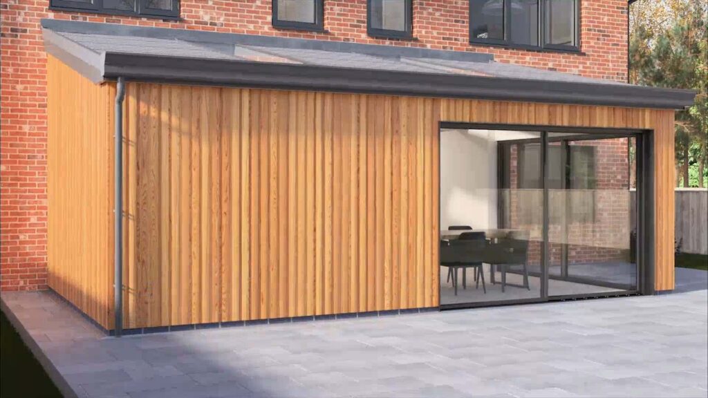 Modern timber-clad rear house extension with large sliding glass doors in Milton Keynes